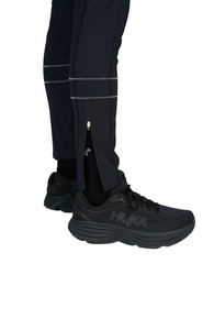 Men's running tights in Black with two reflective contrast seams around the bottom of each leg. Ankle zippers. Made in ECONYL®. UNNA reflective logo on the front leg and "Finish in a Good Place" manifesto in the back. Side pocket for phone.