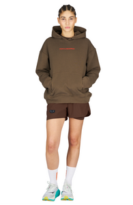 Running shorts in Red Brown, featuring an inner lining and side vents. The 3-inch Flow Shorts offer a soft stretch and are made from ECONYL®. Podium Logo on the front and a reflective "Finish in a Good Place" slogan on the back. Includes one pocket in the inner lining and a hidden pocket at the back. Also available in a 5-inch length.