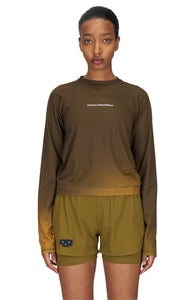 Women's long sleeve Running T-Shirt in Brown/Golden with raglan sleeves. It features a gradient sublimation print shifting to a lighter shade at the bottom. Made from quick-drying, post-consumer recycled polyester with 4-way stretch for great flexibility, ventilation, and breathability. The UNNA "Finish in a Good Place" manifesto is printed on the chest.