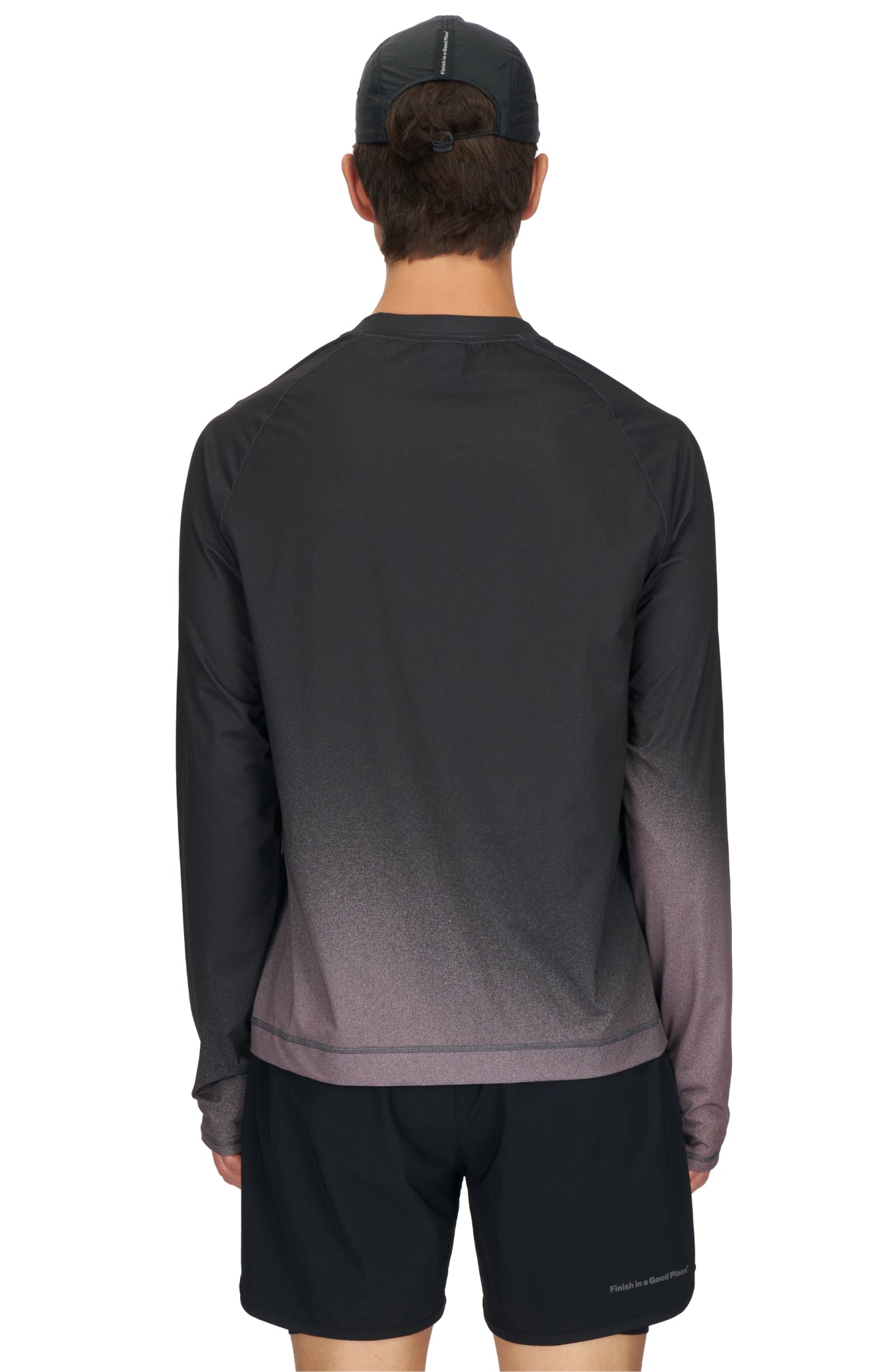 Men's long sleeve Running T-Shirt in Black/Grey with raglan sleeves. It features a gradient sublimation print shifting to a lighter shade at the bottom. Made from quick-drying, post-consumer recycled polyester with 4-way stretch for great flexibility, ventilation, and breathability. The UNNA 