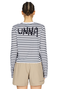 Women’s striped long sleeve Running T-Shirt in White and Navy, featuring raglan sleeves with thumbholes. It has a water-based sublimation-printed stripe pattern and is made from quick-drying, post-consumer recycled polyester with 4-way stretch for flexibility, ventilation, and breathability. A bold, hand-drawn UNNA text on the back.