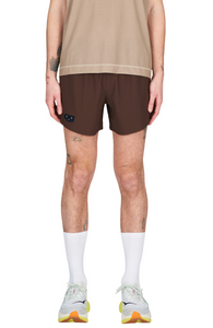 Men's running shorts in Red Brown with a soft stretch and side vents. Podium Logo in the front and reflective "Finish in a Good Place" slogan on the back. Two smart hidden pockets on the inside to keep your phone and keys/headphones in place. Made in Econyl.