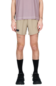 Men's running shorts in Warm Sand with a soft stretch and side vents. Podium Logo in the front and reflective "Finish in a Good Place" slogan on the back. Two smart hidden pockets on the inside to keep your phone and keys/headphones in place. Made in Econyl.