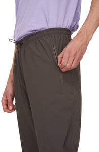 UNNA straight running pants in wren green with a soft stretch and two front pockets.