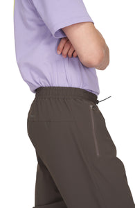 Men's wren green running pants with two front pockets and UNNA logo in the back. 